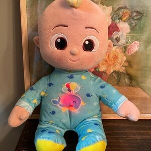 Adorable Cocomelon Plush Doll with Blue Outfit. Lights up and sings.